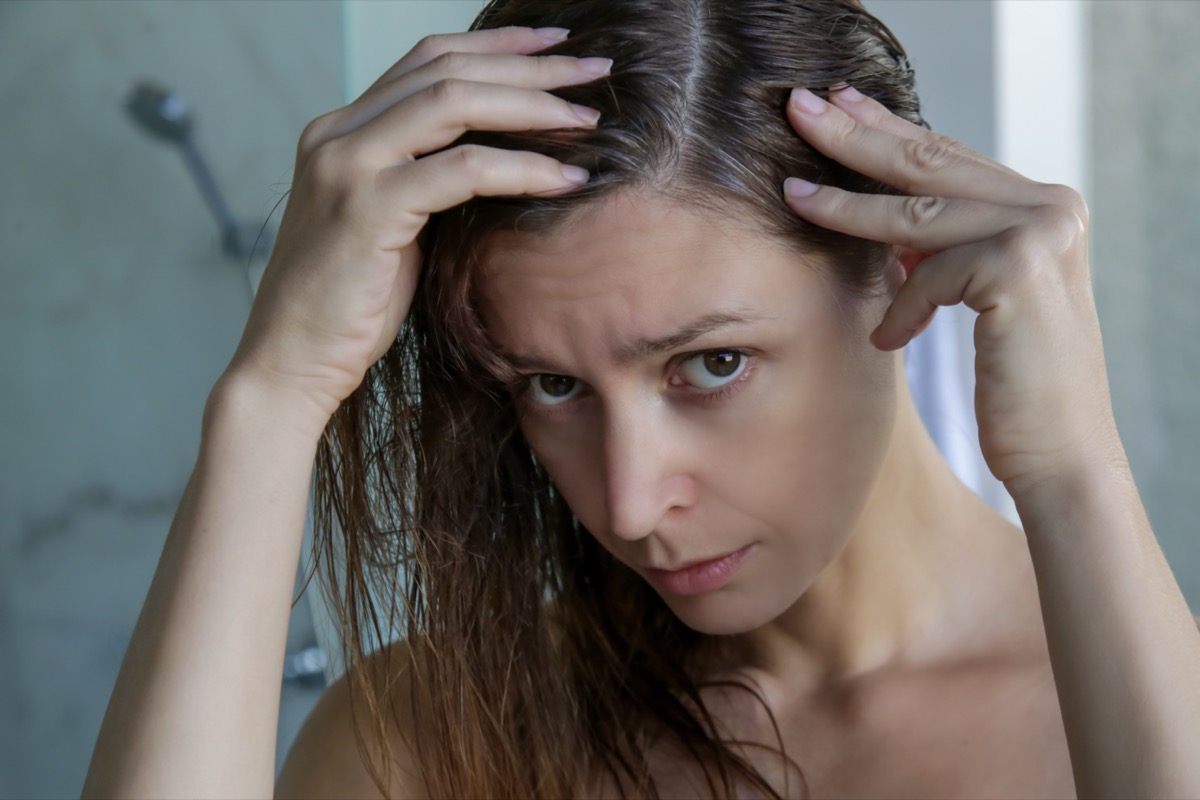 Portrait,Of,A,Beautiful,Young,Woman,Examining,Her,Scalp,And