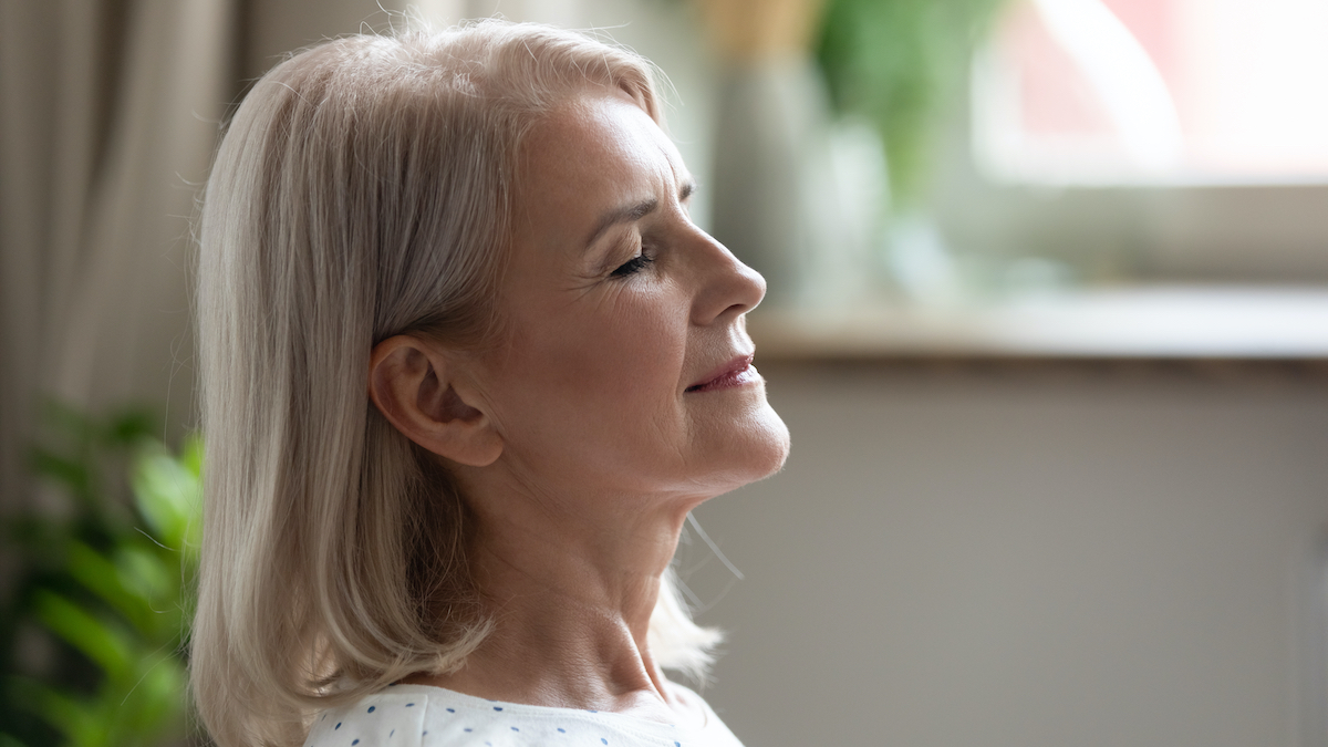 woman over 50 breathing exercise