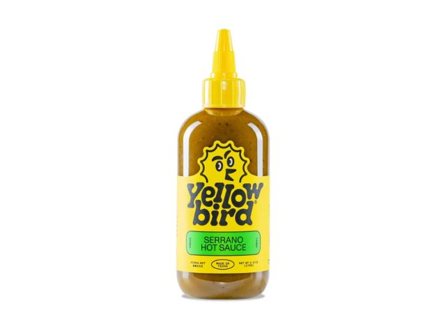 bottle of yellow bird hot sauce on a white background
