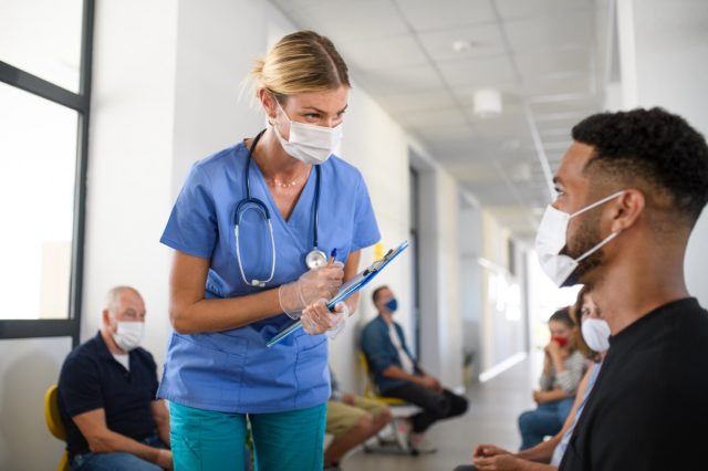 Portrait of nurse and man with face masks