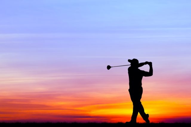 569732836. silhouette golfer playing golf during beautiful sunset