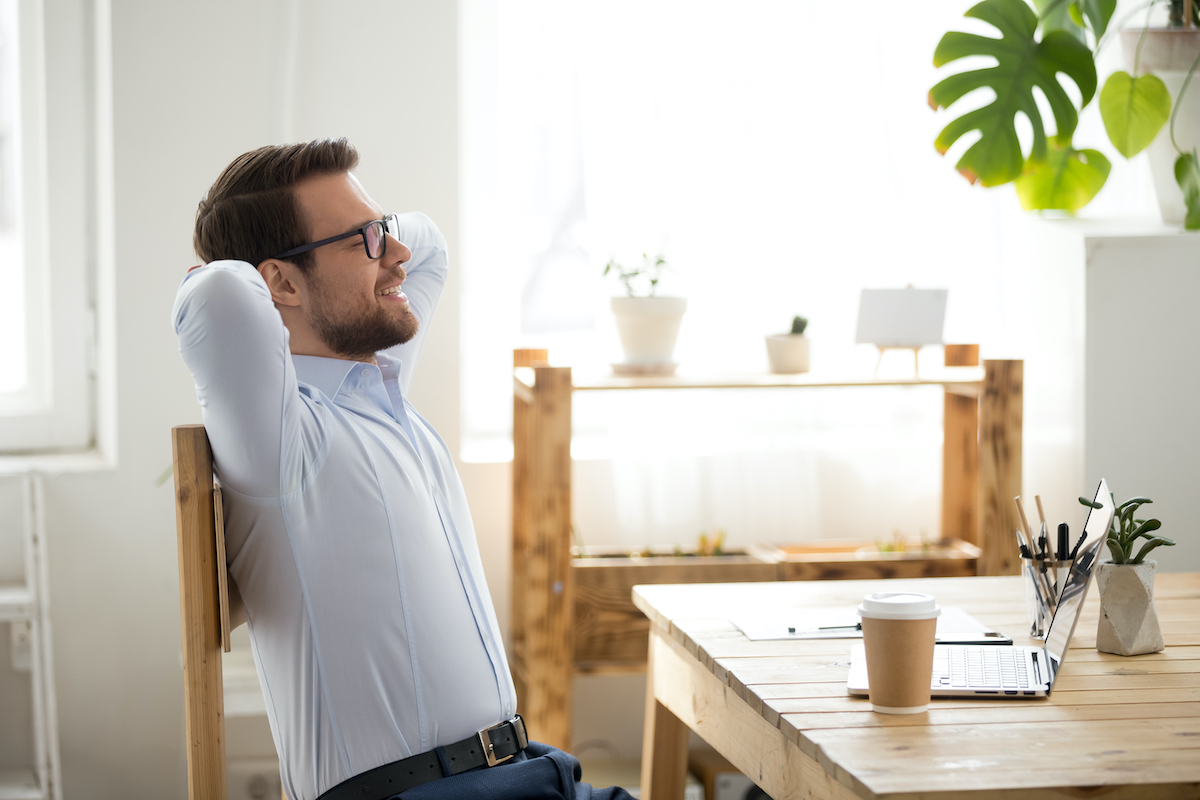 man seated and working his core