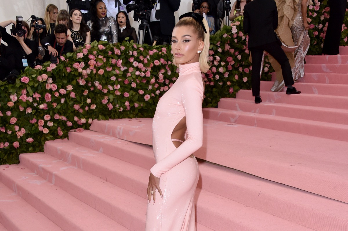 hailey bieber wearing pink dress on met gala red carpet