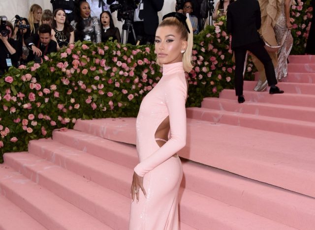 hailey bieber wearing pink dress on met gala red carpet