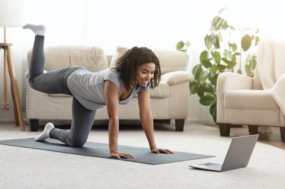 woman doing hip exercise at home