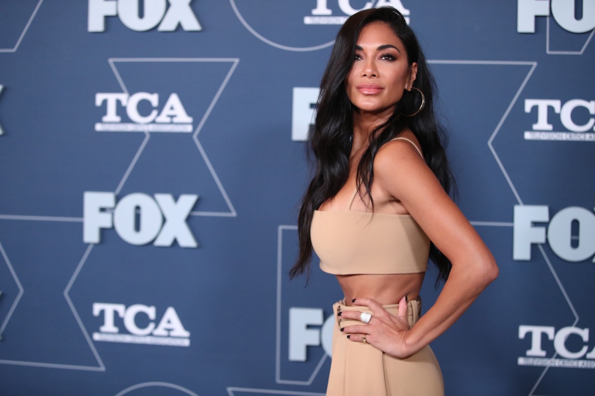 nicole scherzinger in tan bandeau top and tan pants on red carpet