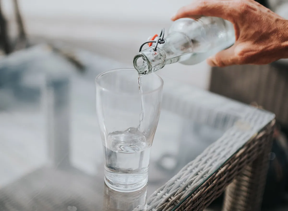 pouring cold water into a glass