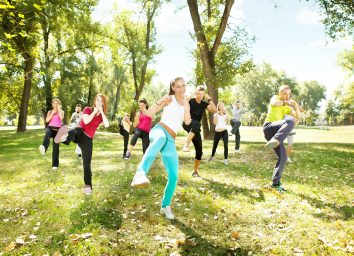 large group of young people training Tae Bo, outdoor