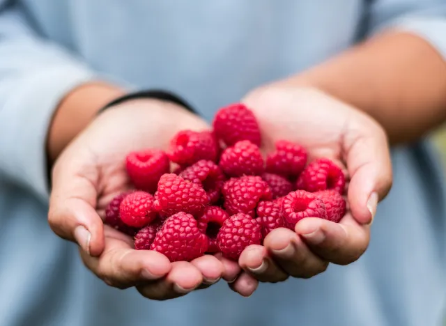 raspberries in hand