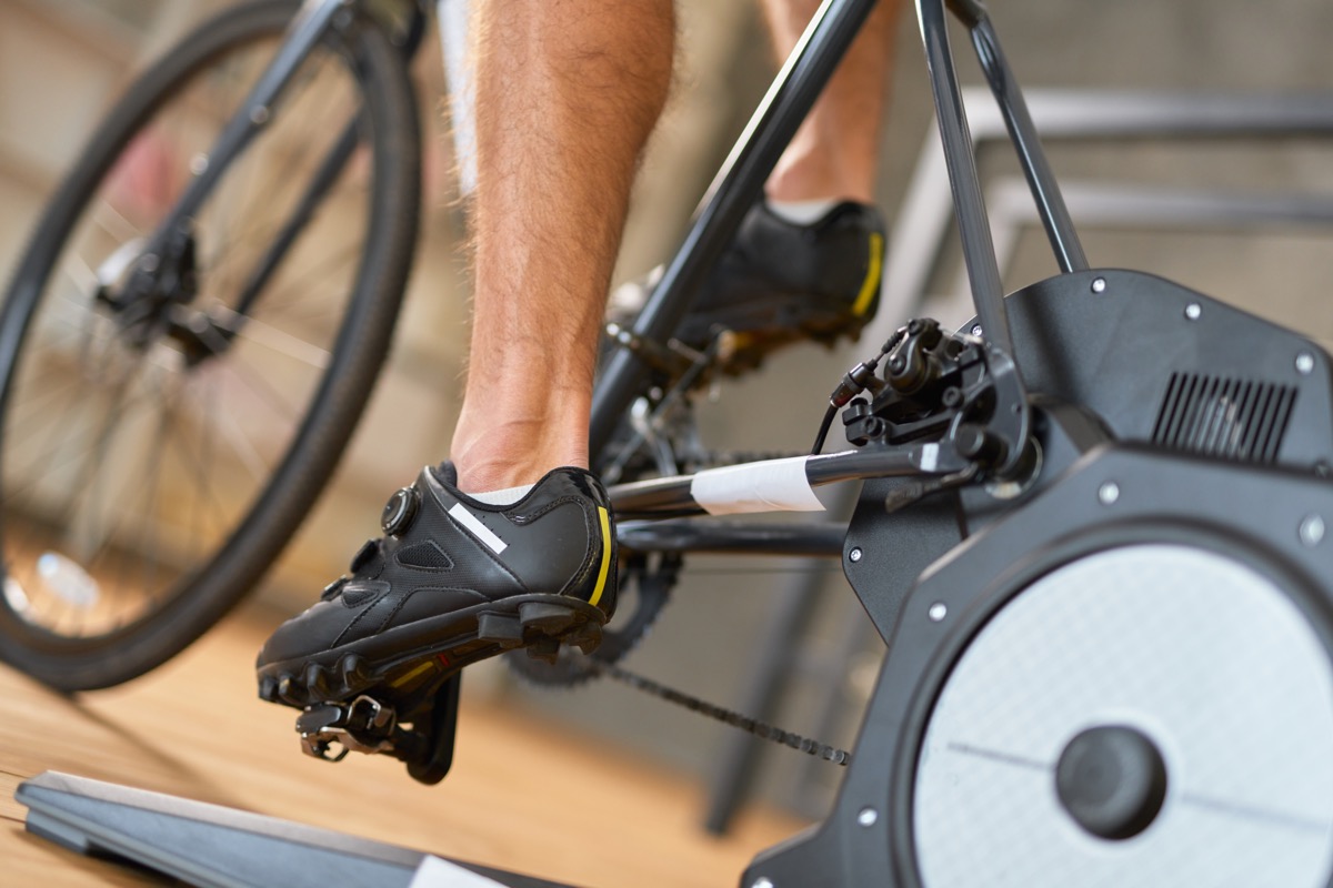 man riding stationary bike