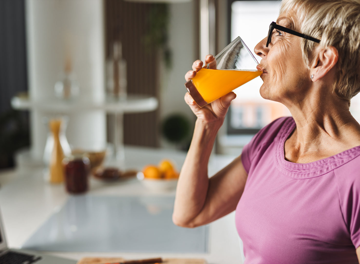 middle-aged woman drinking juice