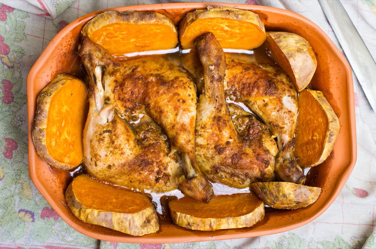 chicken and sweet potatoes in ceramic dish