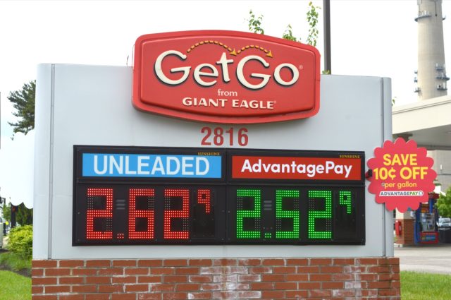 electronic sign displaying gas prices at getgo by giant eagle convenience store in daylight