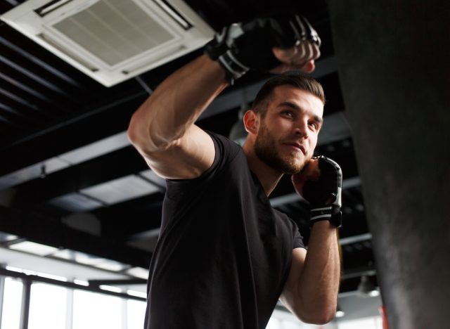 man boxing throwing a punch