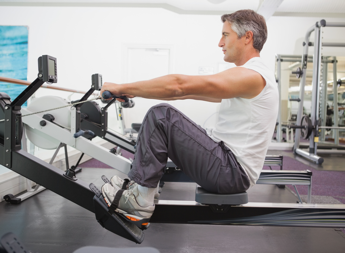 man at the gym on rowing machine
