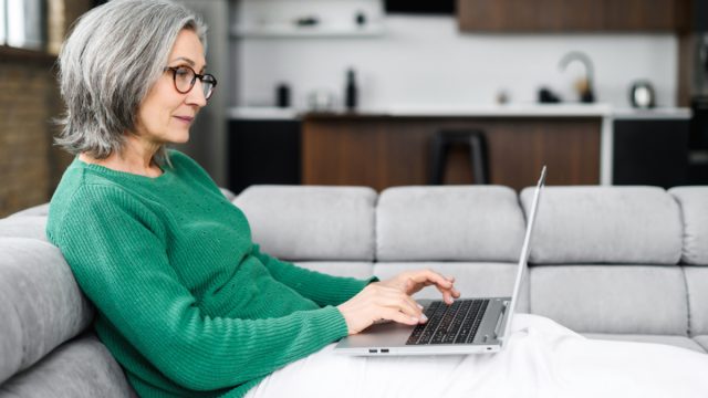 older woman using laptop