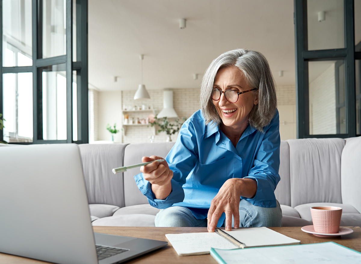 older woman working and smiling