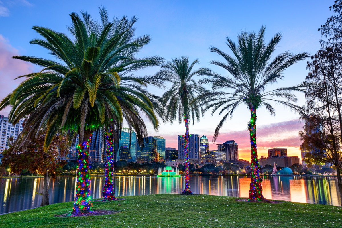 orlando florida at dusk in front of eola lake