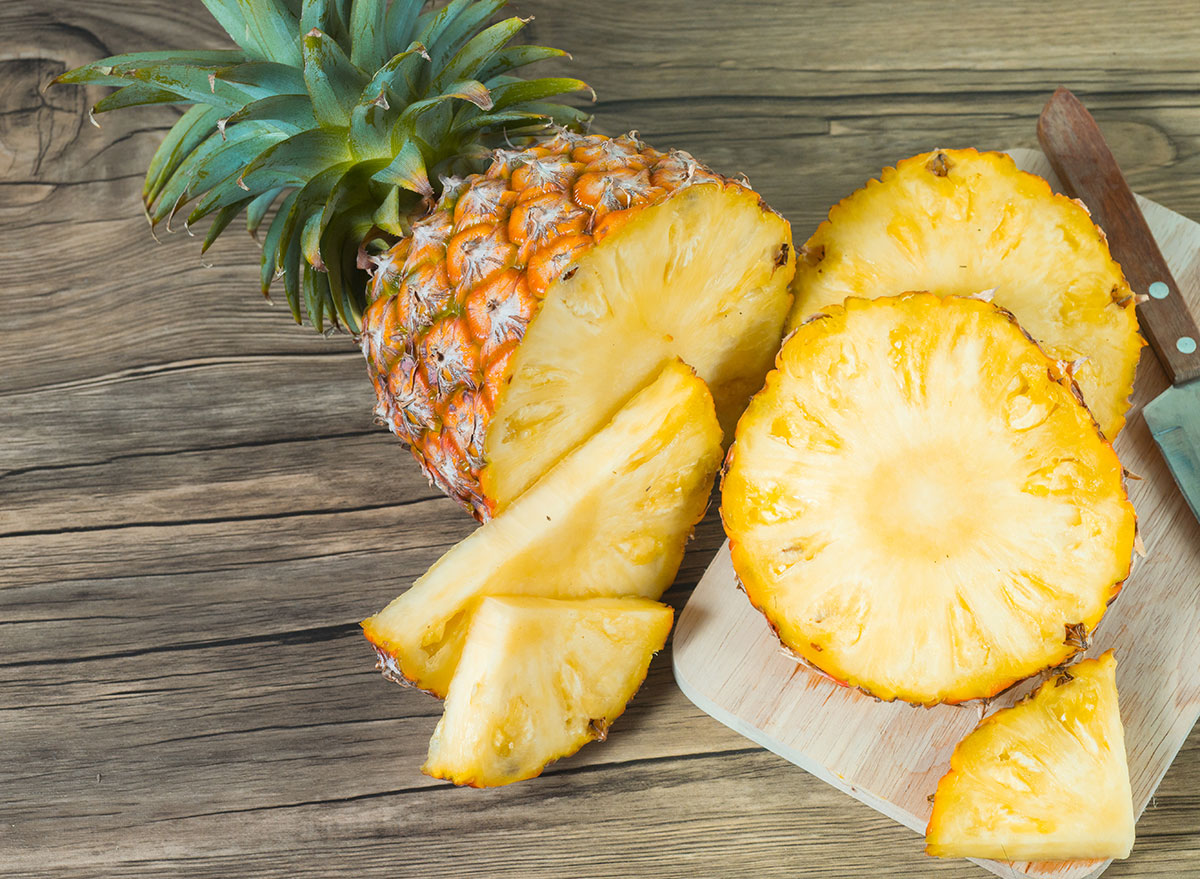 slicing pineapple