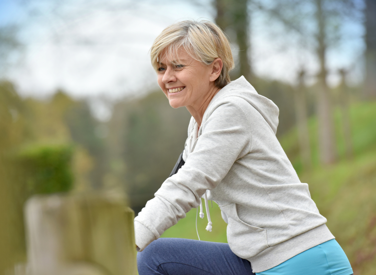 50 year old woman exercising happy