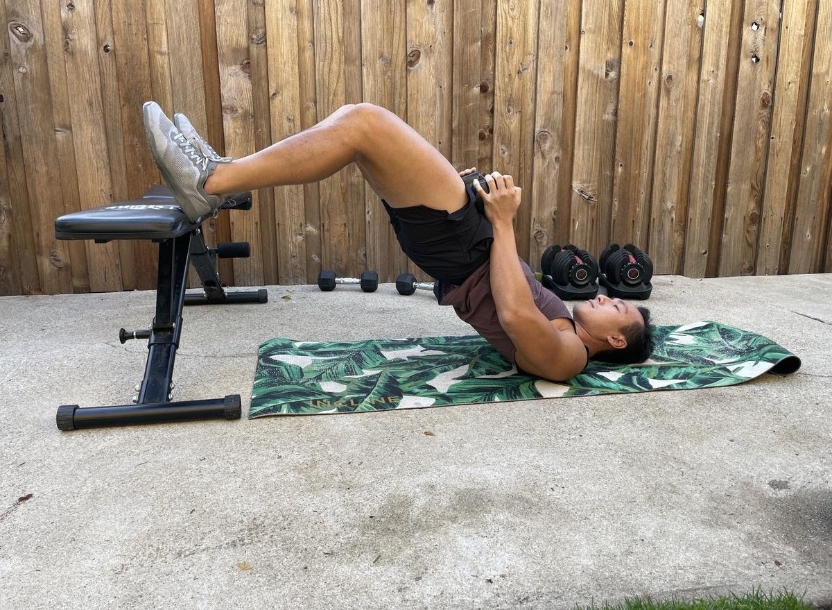 dumbbell heels elevated glute bridge