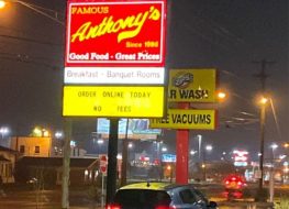 famous anthony's restaurant exterior at night with illuminated sign