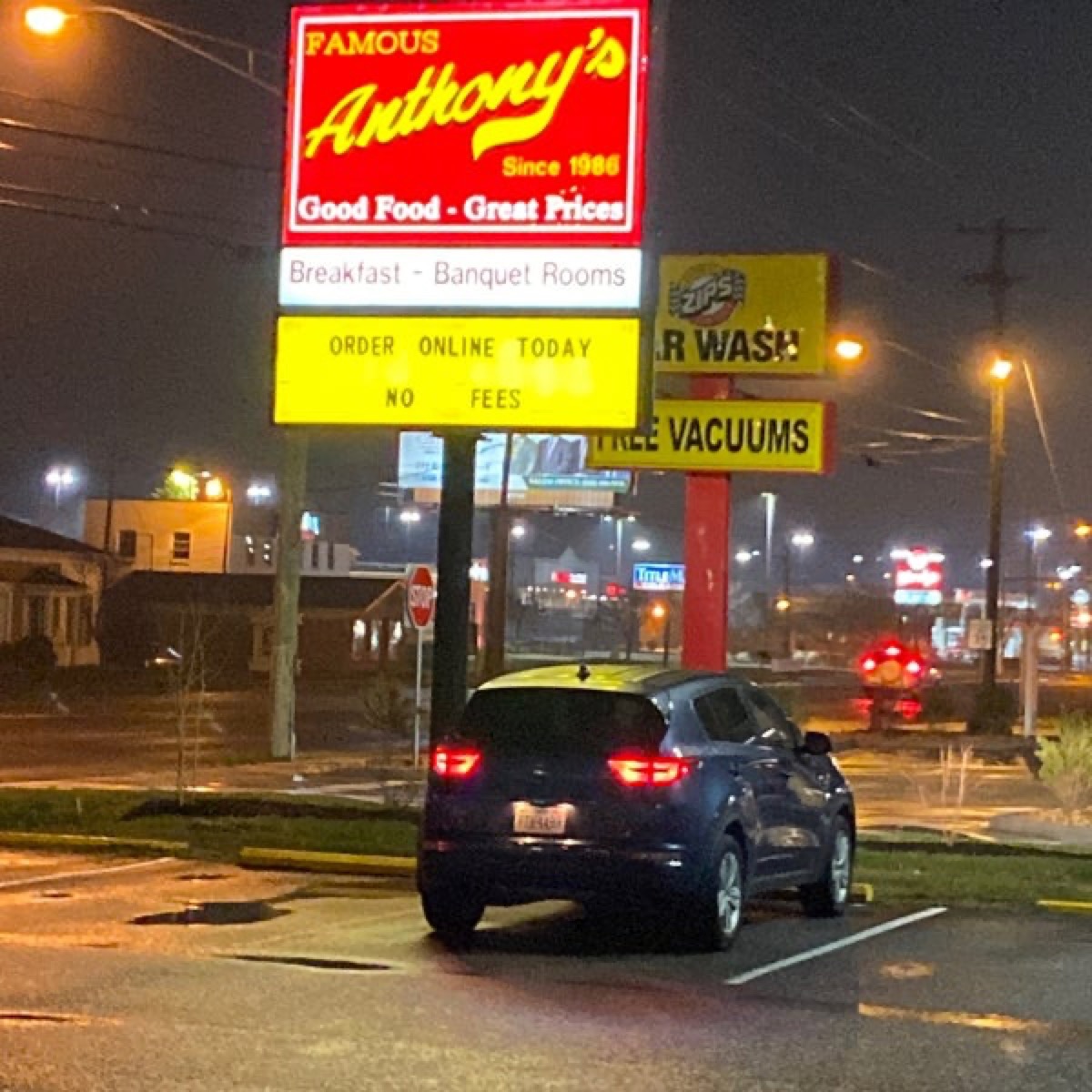 exterior shot of illuminated sign at famous anthonys restaurant at night