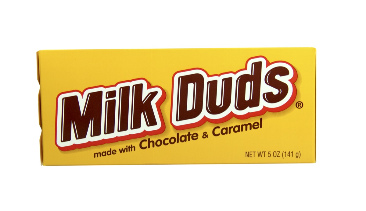 box of milk duds on white background
