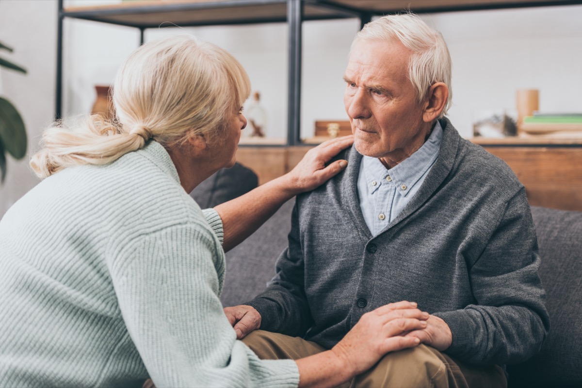 older man with dementia speaking to caregiver