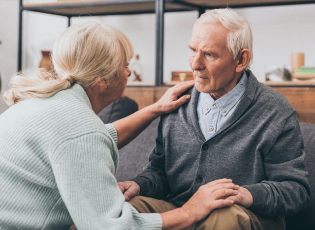 older man with dementia speaking to caregiver