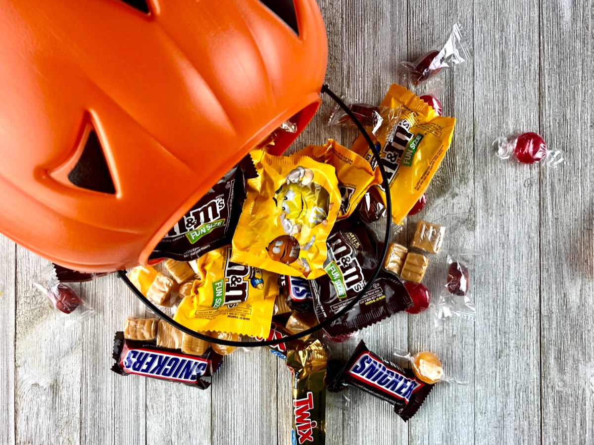 plastic pumpkin spilling out halloween candy