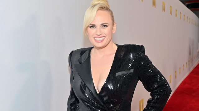 rebel wilson in black sequin jacket on red carpet