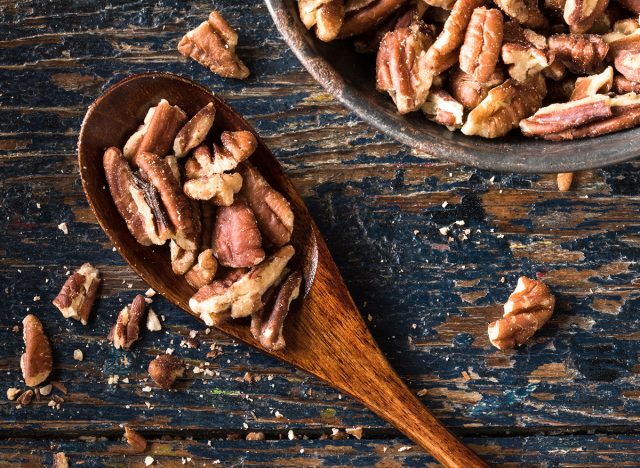 spoon of pecans on a table