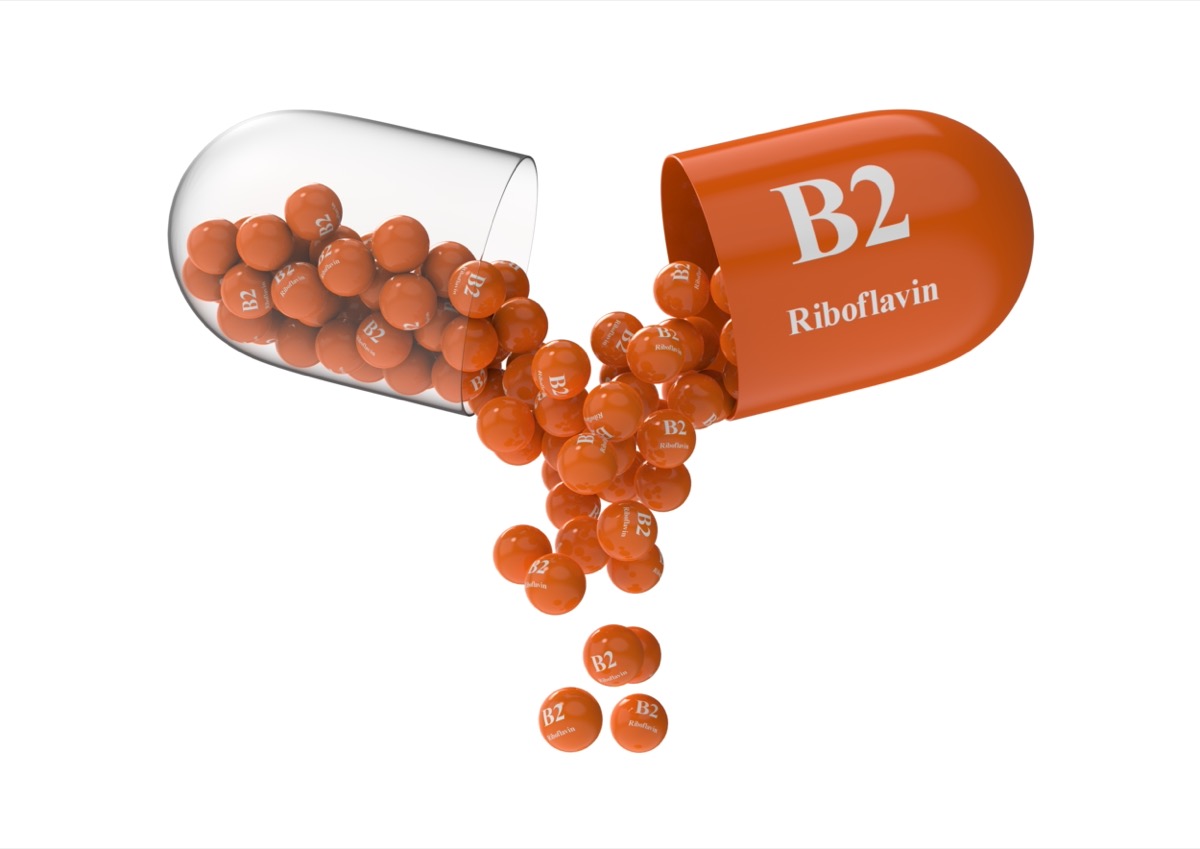 Open capsule with b2 riboflavin from which the vitamin composition is poured.
