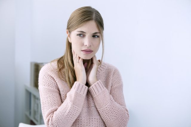 Woman With Sore Throat