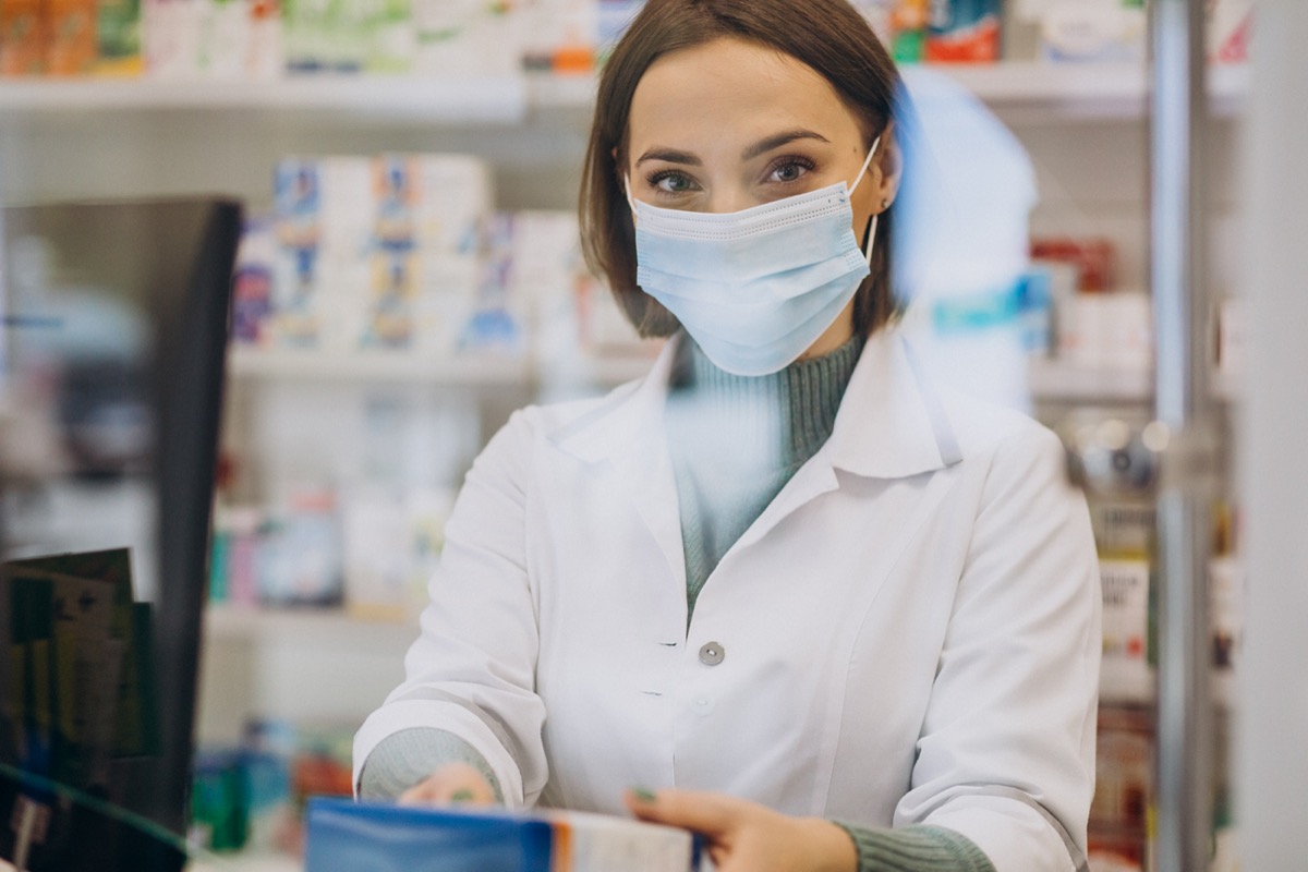 Young woman pharmacist at pharmacy
