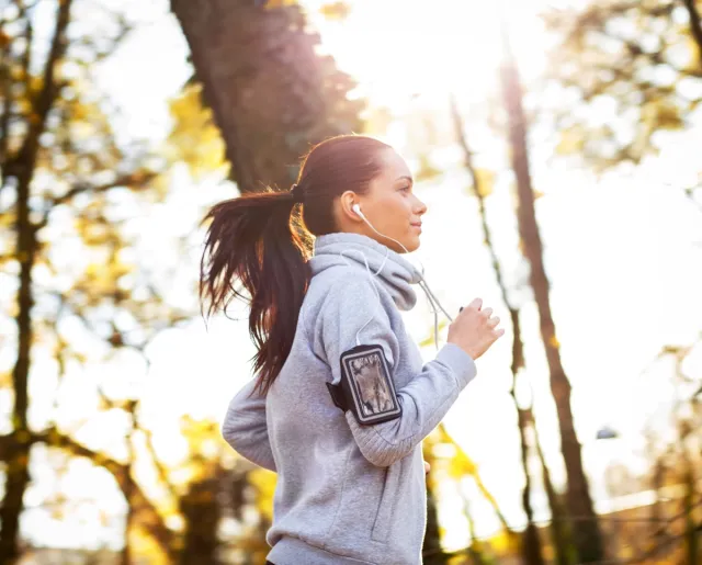 young woman running outdoors