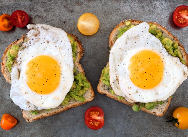 Avocado and eggs on whole grain toast