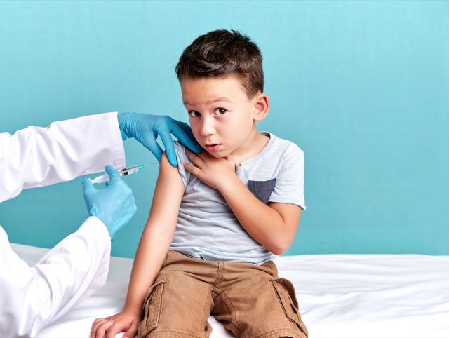 The pediatrician vaccinates the child.