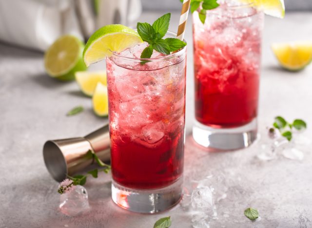 cranberry lime cocktail in highball glass