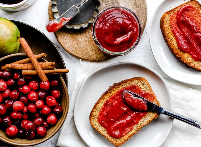 cranberry pear butter spread on a piece of toast