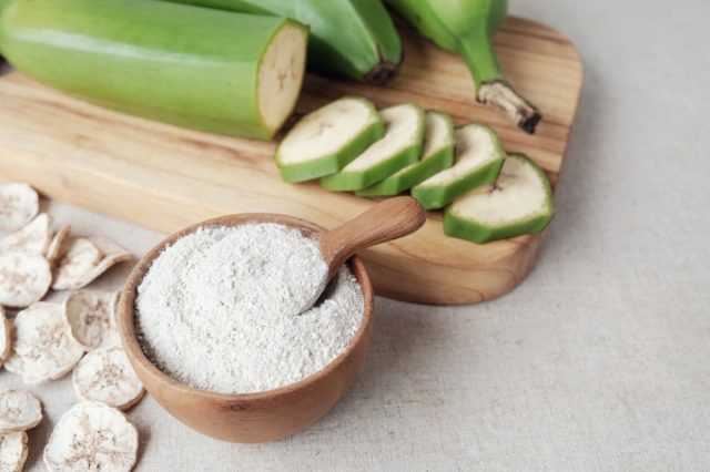 green banana flour on wooden cutting board