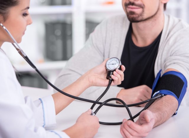 man having blood pressure checked