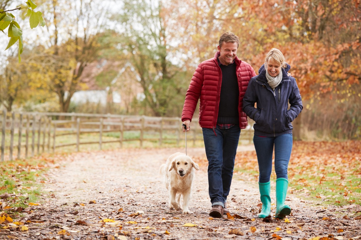 middle aged couple walking outdoors