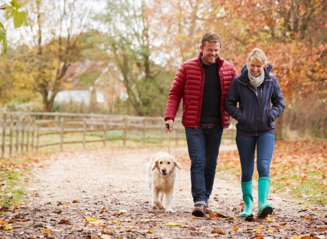 middle aged couple walking outdoors