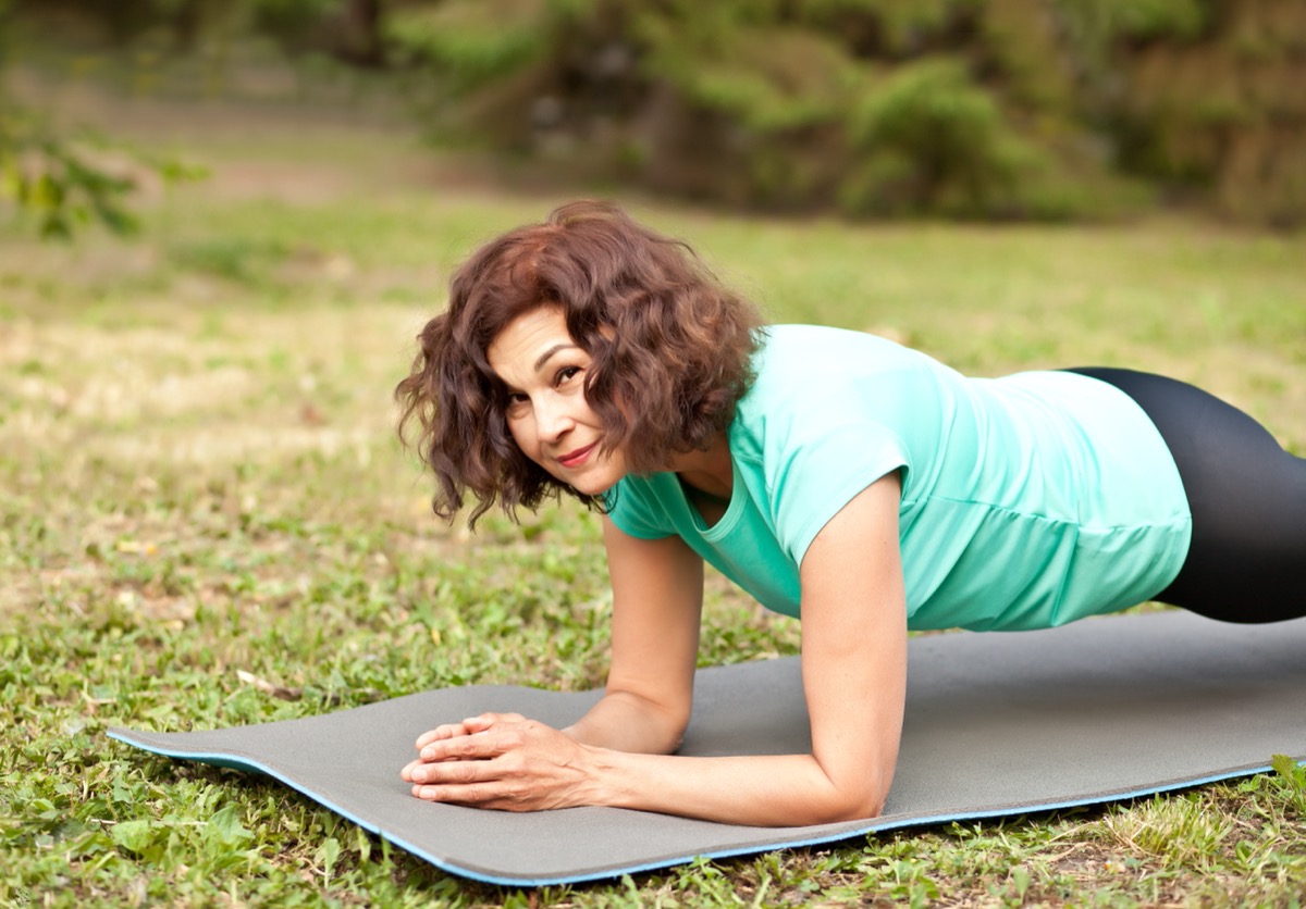 middle aged woman doing plank