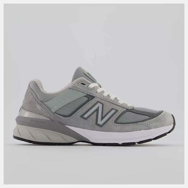 gray new balance sneakers on white background