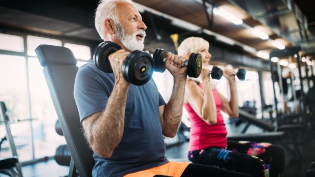 older couple exercising at gym
