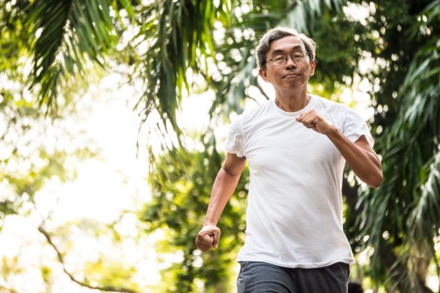 older man walking outdoors