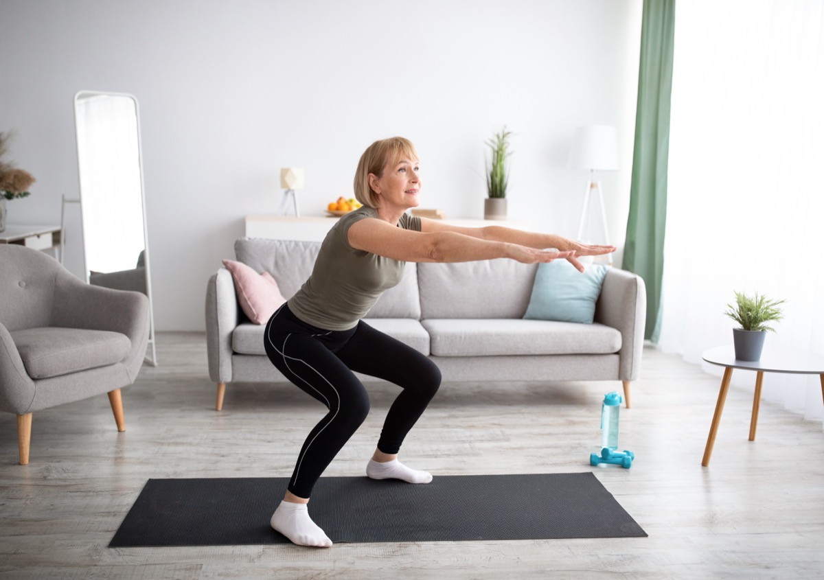 older woman doing squats